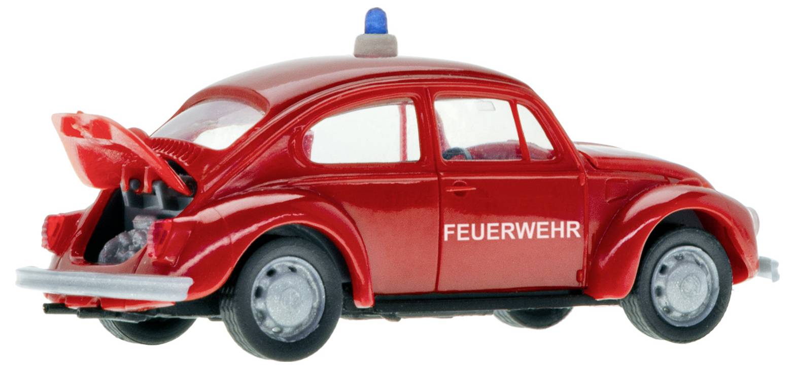 Rotes Spielzeug-Feuerwehrauto mit blauem Licht auf dem Dach und offener Heckklappe, beschriftet mit „FEUERWEHR