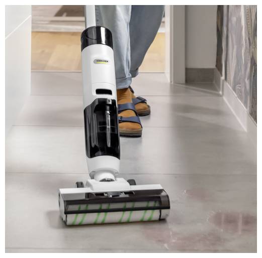 Eine Person benutzt einen schnurlosen Bodenreiniger auf einem glatten Innenboden in einem Flur.