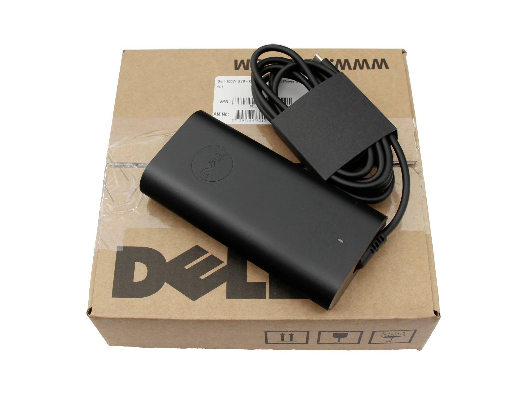 Dell-Laptop-Netzteil mit aufgewickeltem Kabel, das auf einer Dell-Pappschachtel ruht
