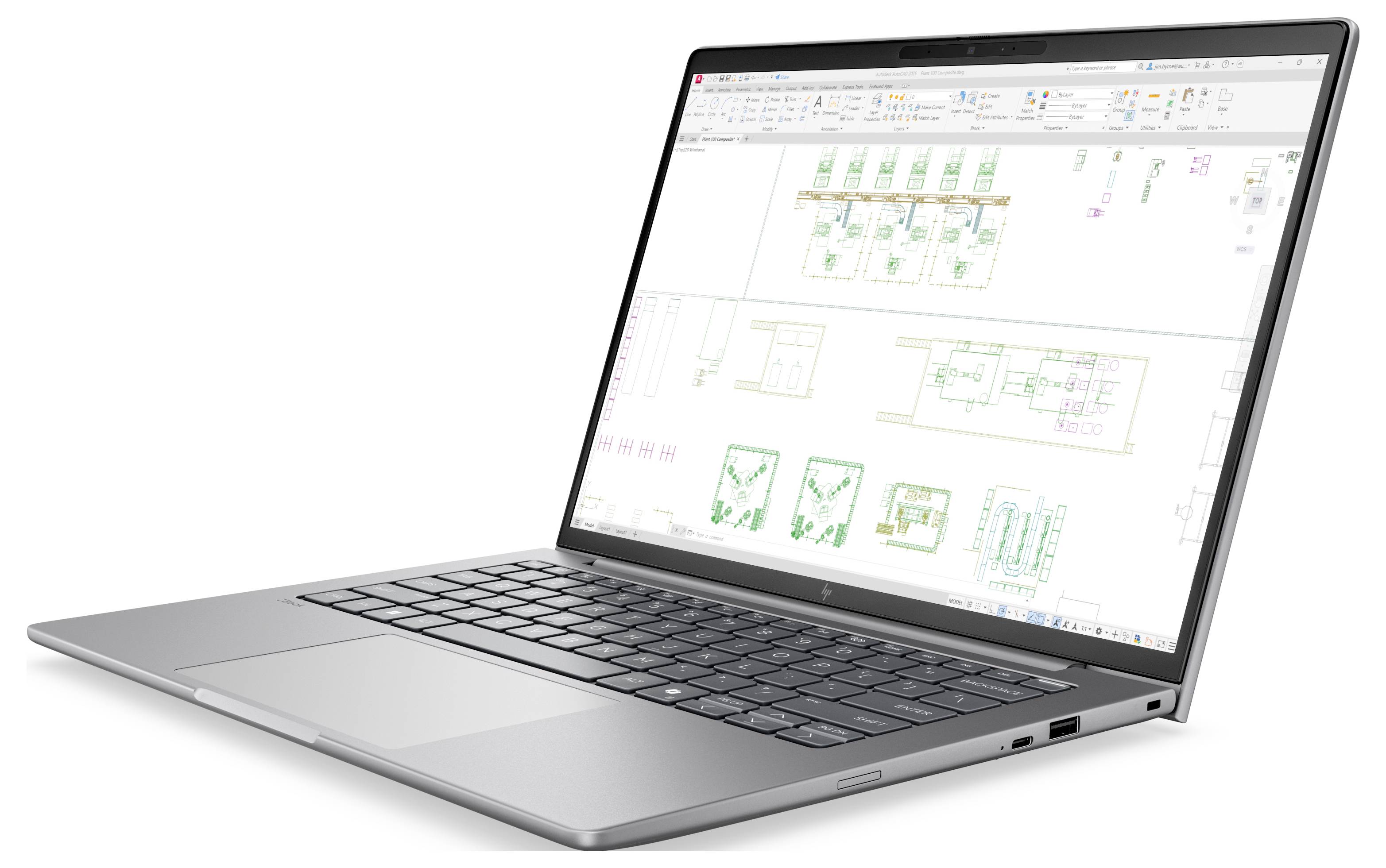 Ein silberner Laptop zeigt eine Präsentation mit dem Titel „Quantum Forge