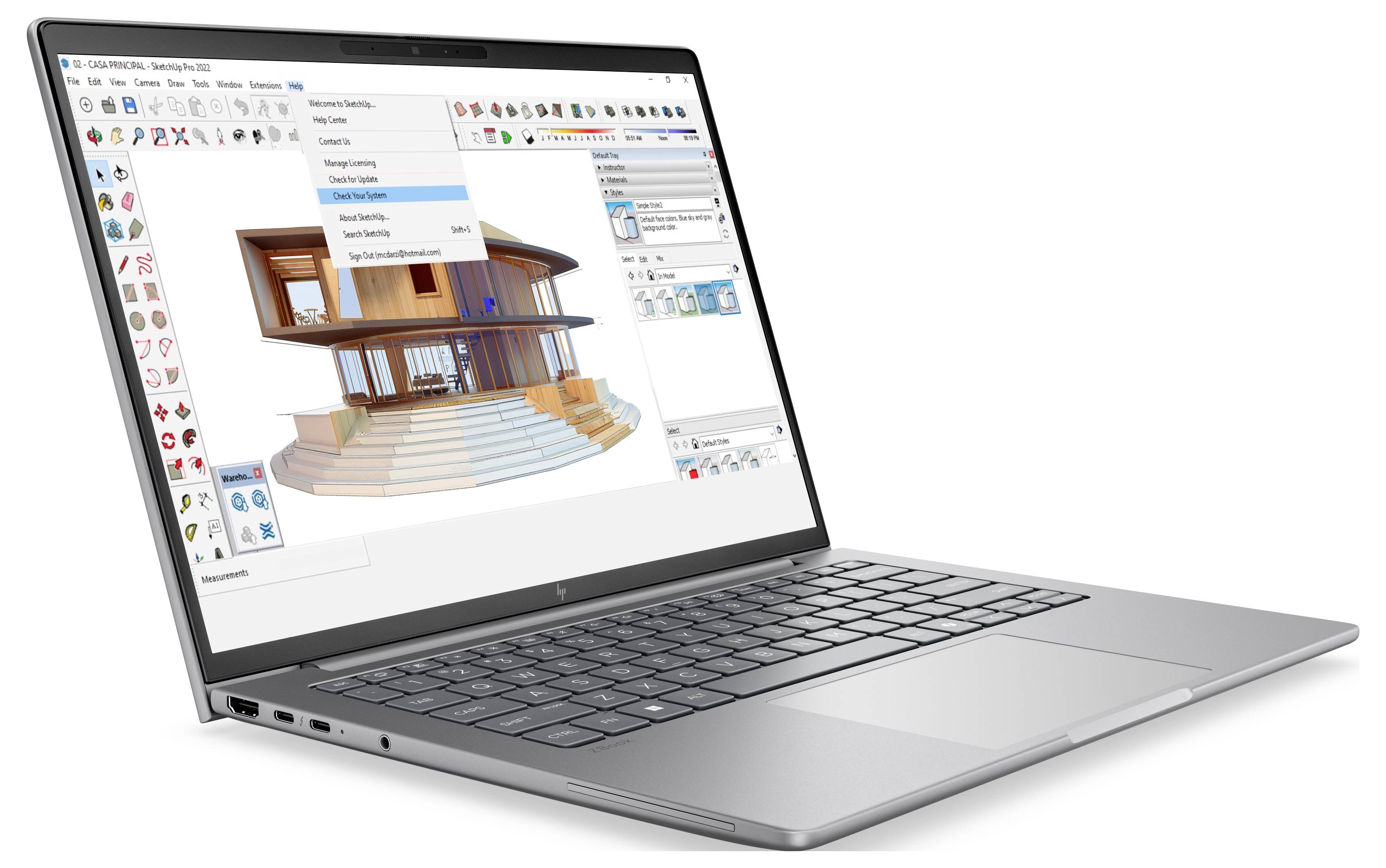Laptop zeigt 3D-Architekturdesign-Software mit einem modernen Hausmodell, Symbolleisten und einem offenen Dropdown-Menü auf dem Bildschirm.