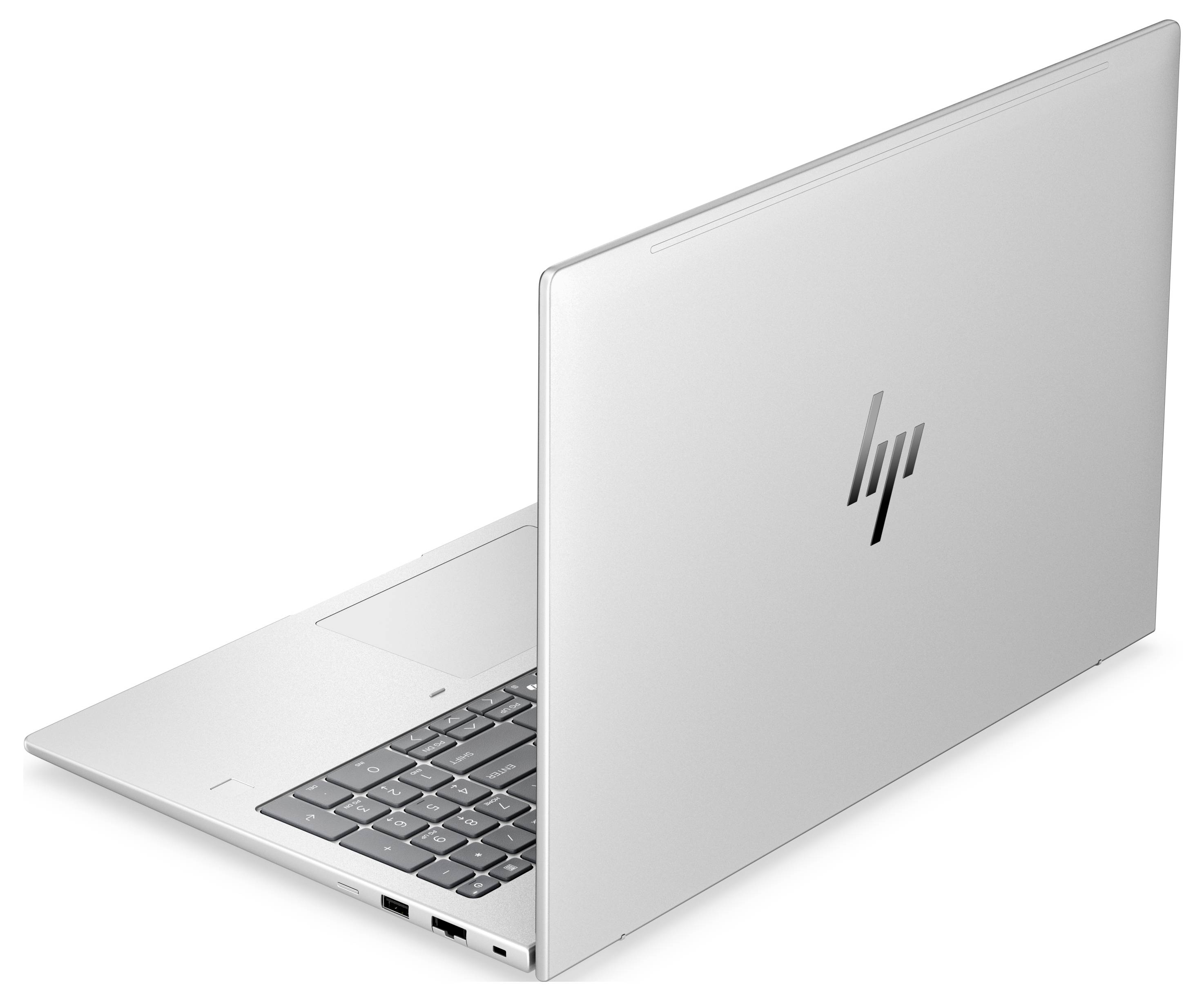 Silberner HP-Laptop teilweise geöffnet, aus der hinteren linken Perspektive fotografiert, zeigt die Tastatur und das HP-Logo auf dem Deckel.