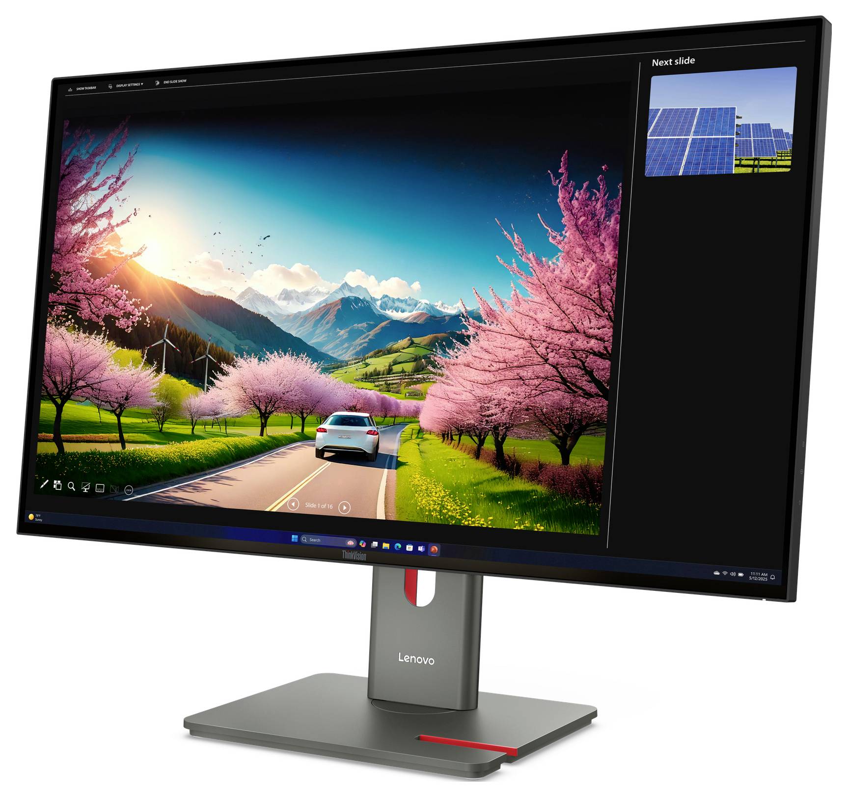 Lenovo-Monitor zeigt eine lebendige Straßenszene mit einem Auto, rosa blühenden Bäumen, Bergen und einer 