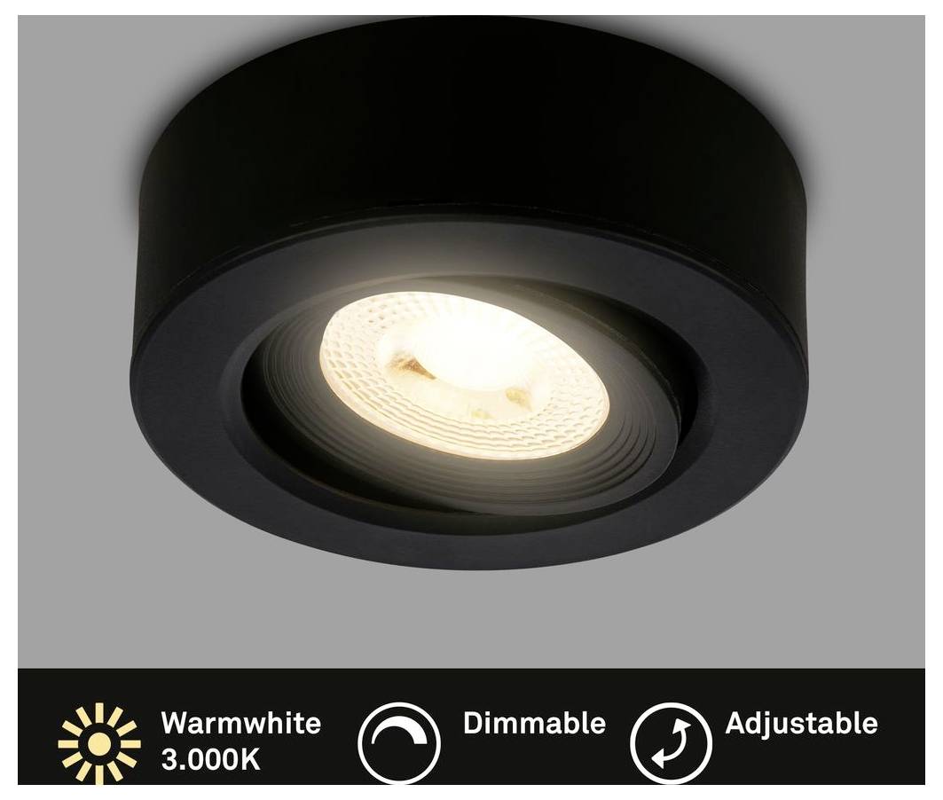 Runde weiße Deckenlampe, die sanft in einem unscharfen Innenraum glüht.
