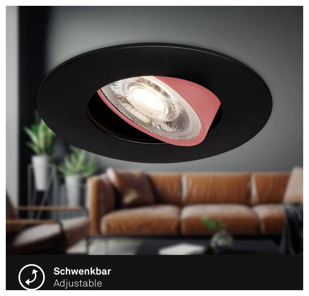 Schwarzer verstellbarer Deckenspot mit sichtbarer Lampe, gezeigt in einem modernen Wohnzimmer; das Etikett liest „Schwenkbar