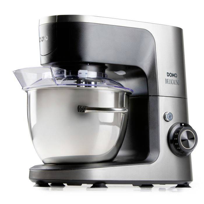 Silver Domo Delicioso stand mixer with stainless steel bowl and clear splash guard, shown on a white background.
