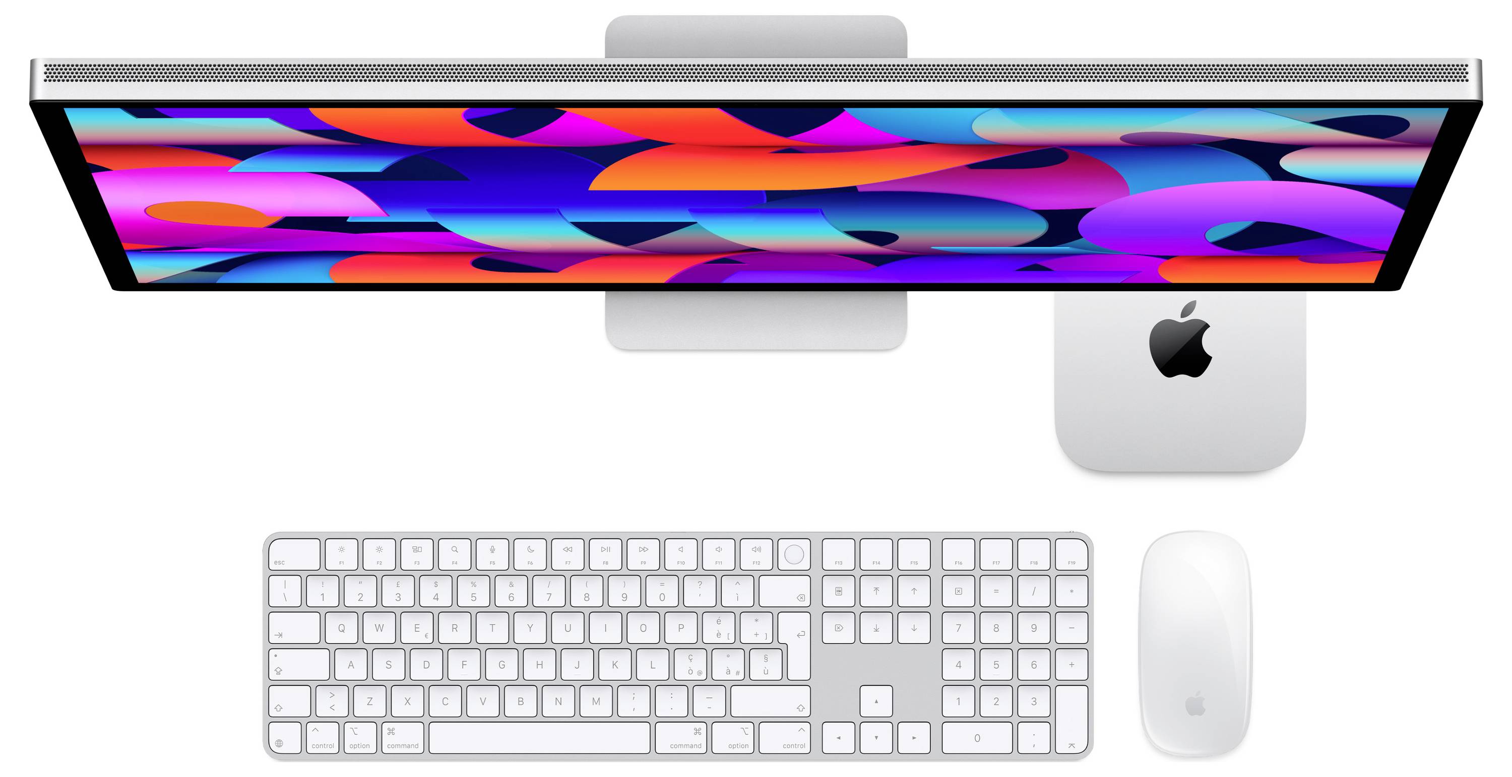 Draufsicht eines Apple iMac-Setups mit farbenreichem abstraktem Bildschirm, Tastatur, Maus und Trackpad auf weißem Hintergrund.