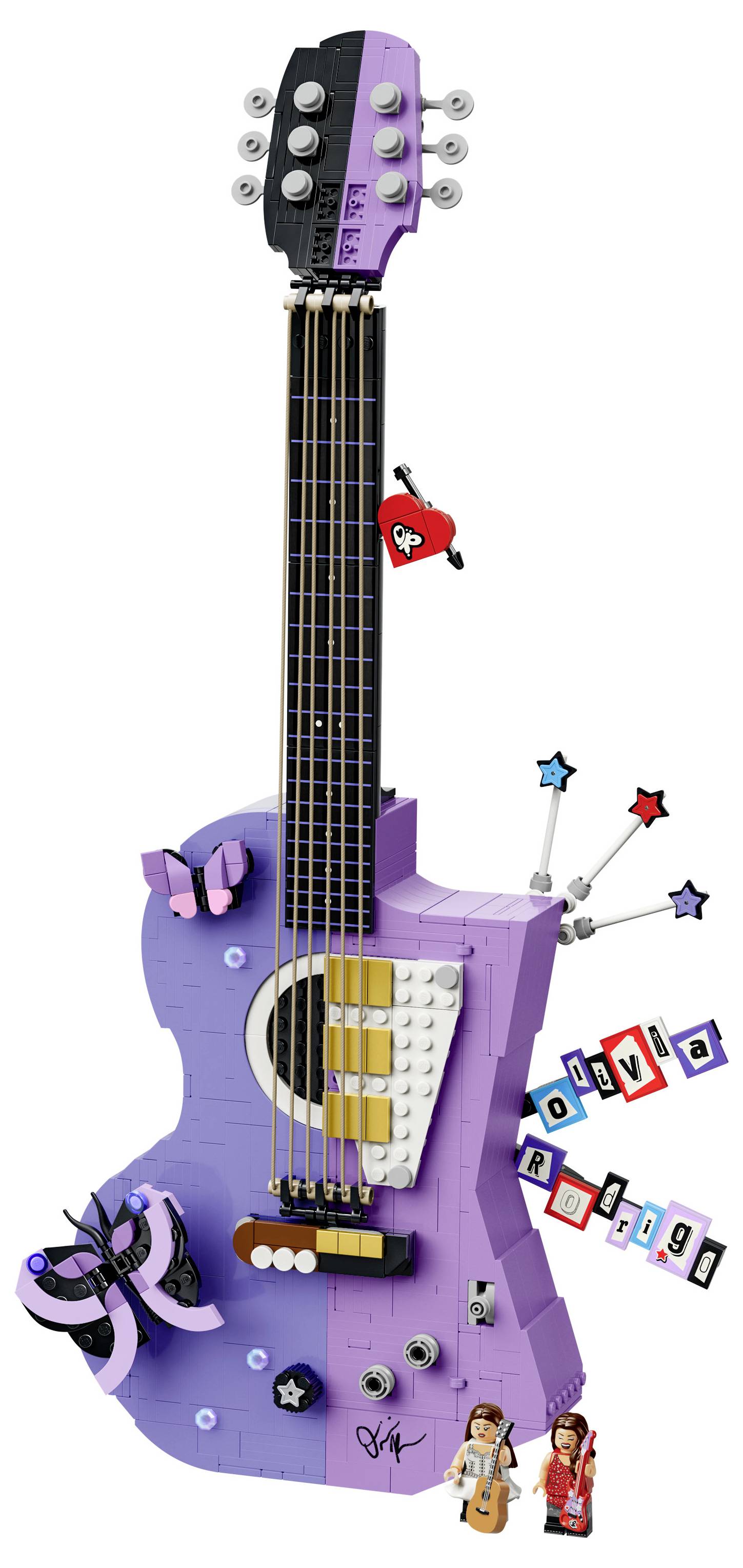 Violettes gitarrenförmiges Spielzeuginstrument mit Tasten, Knöpfen, Zauberstäben mit Sternen und kleinen Figuren, das einem verspielten Musik-Spielcontroller ähnelt