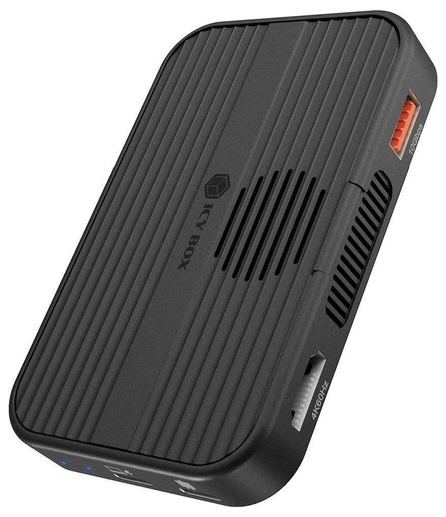 Black Kiox kompaktes elektronisches Gerät mit belüftetem Deckel, Seitenöffnungen und Statusleuchten, gezeigt auf weißem Hintergrund.
