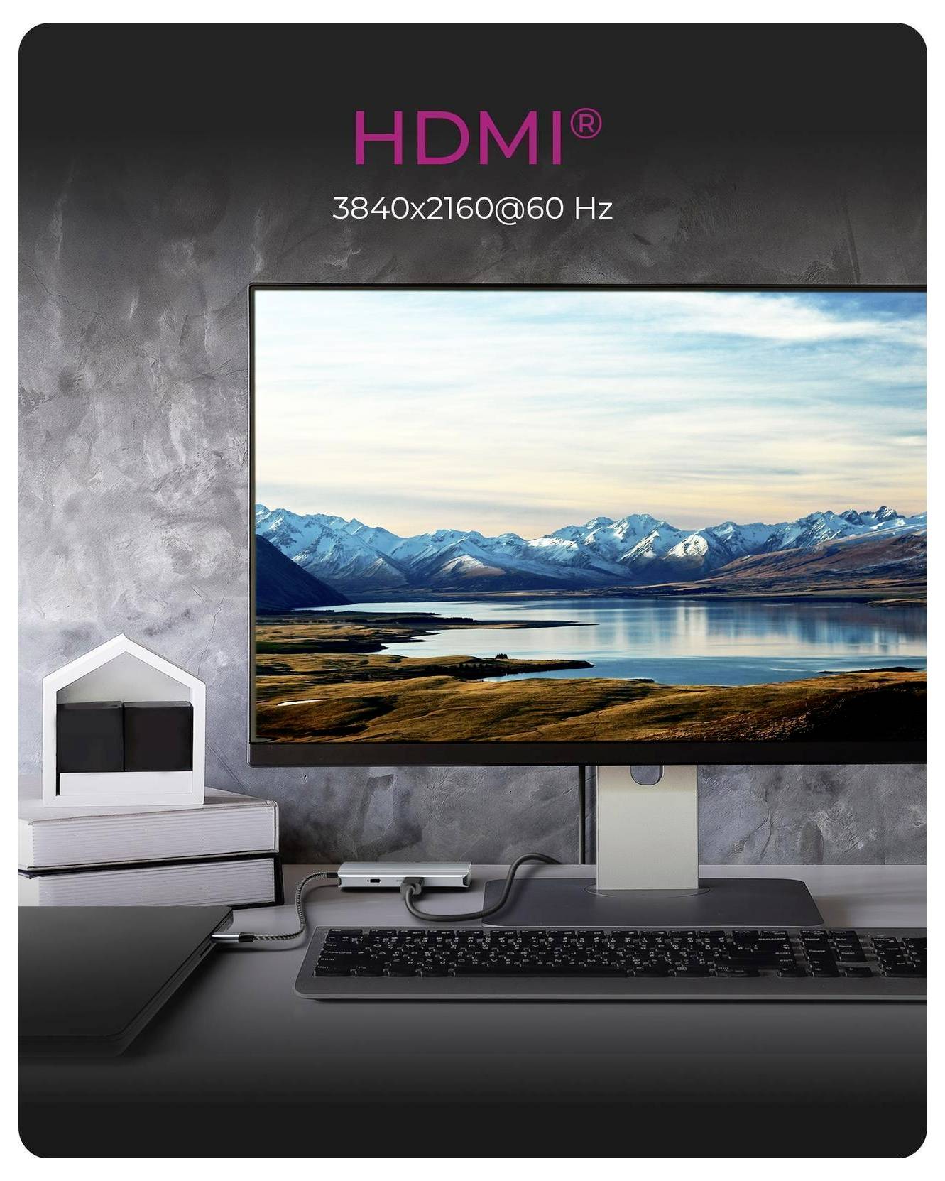 Computermonitor zeigt eine Bergseelandschaft an, mit HDMI-Text oben, der 