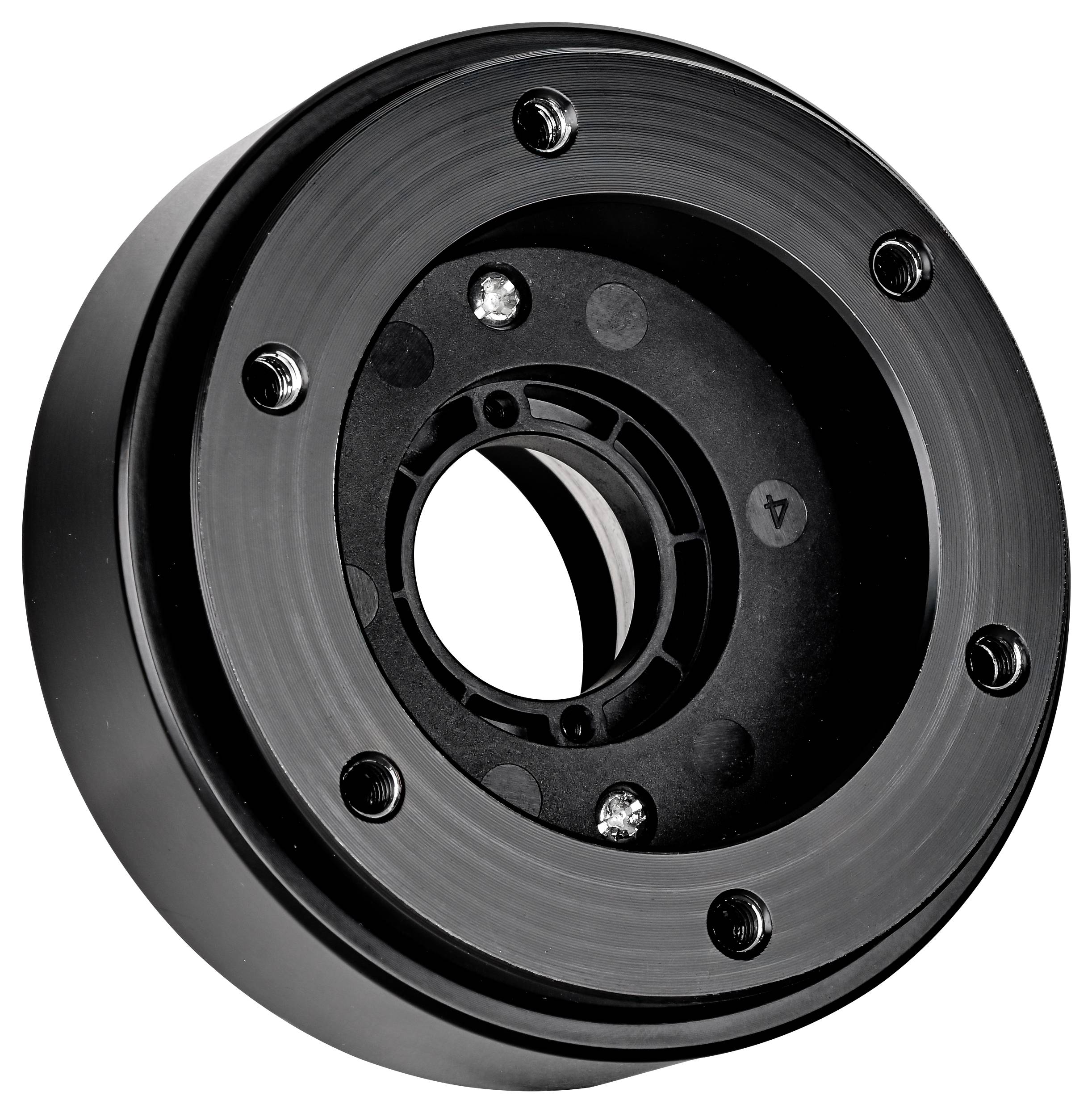 Nahaufnahme eines schwarzen, kreisförmigen metallischen mechanischen Teils mit Bolzen und einer zentralen Öffnung, dargestellt vor weißem Hintergrund.