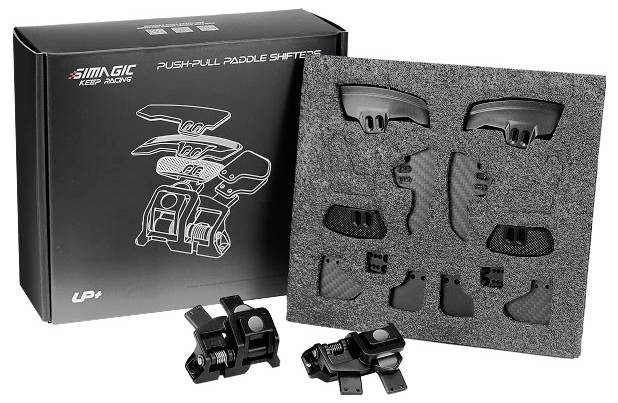 Verpackung für SIMGIC Push-Pull-Schaltwippen mit Schaumstofffüllung und Einzelteilen sowie zwei schwarzen Schaltwippenkomponenten vorne.