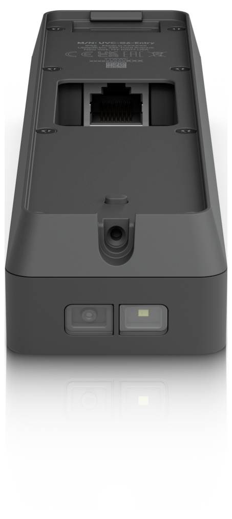 Rückansicht eines dunkelgrauen elektronischen Geräts mit einem Ethernet-Anschluss, einem Stromschalter und einer Statusleuchte an der unteren Kante.
