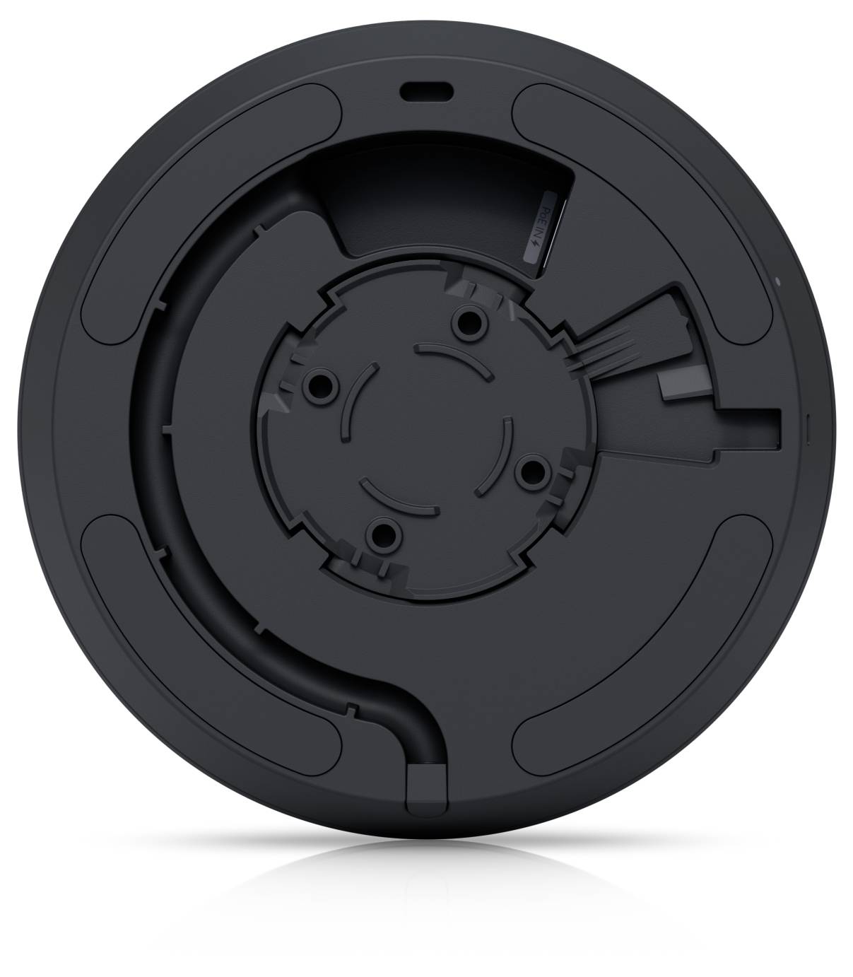Vorderansicht einer schwarzen kreisförmigen mechanischen Vorrichtung oder Montagebasis mit vertieften Nuten und zentralen Befestigungspunkten auf weißem Hintergrund.