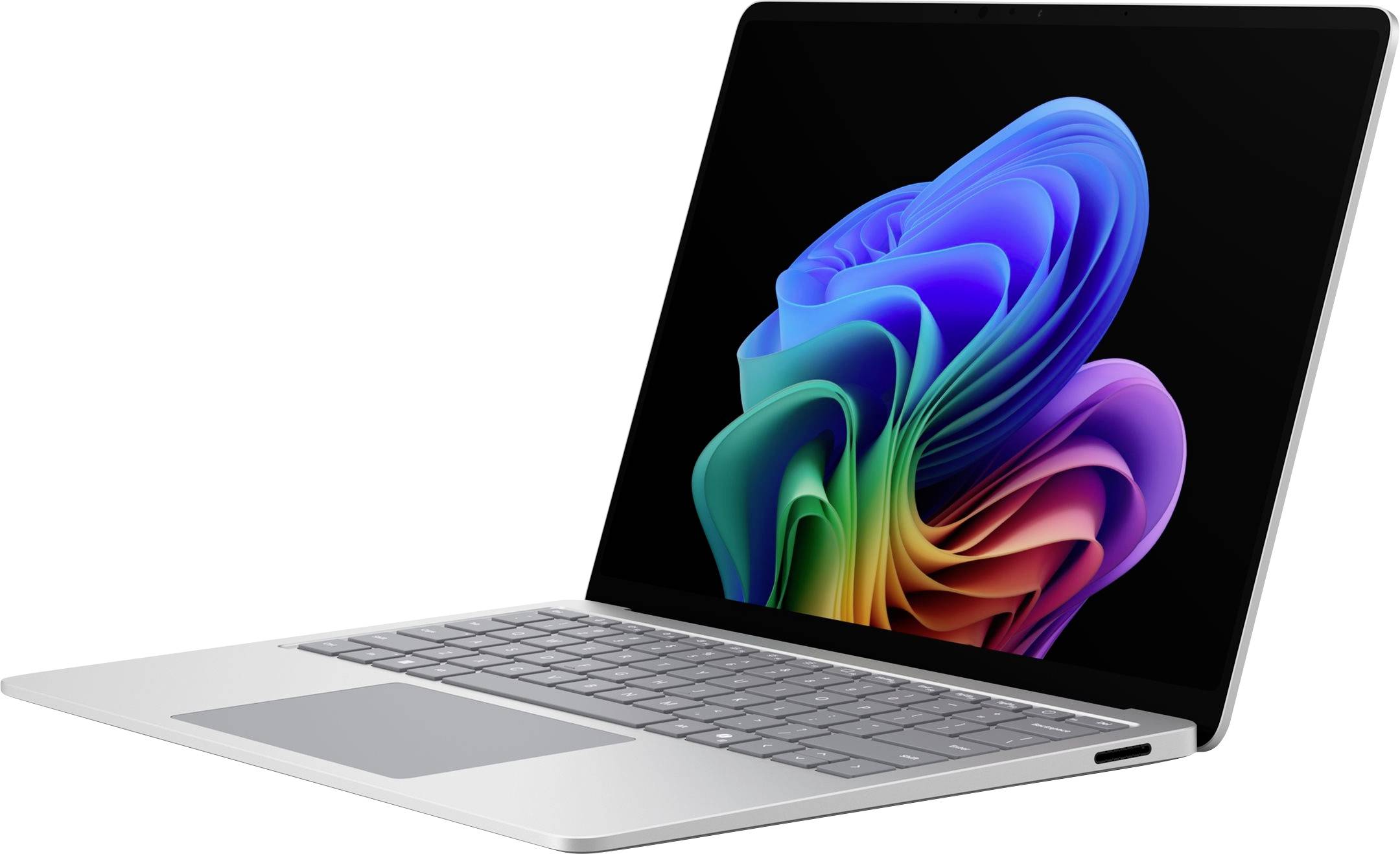 Silberner Laptop, der in einem Winkel offen angezeigt wird, mit buntem abstraktem Blumenmuster auf dem Bildschirm.