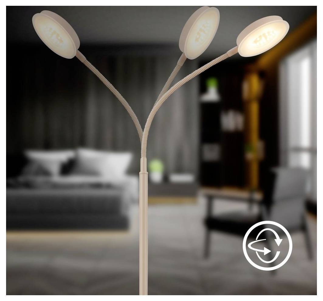 Dreikopfige verstellbare Stehleuchte mit flexiblen Armen und beleuchteten runden Schirmen in einem modernen Schlafzimmer.
