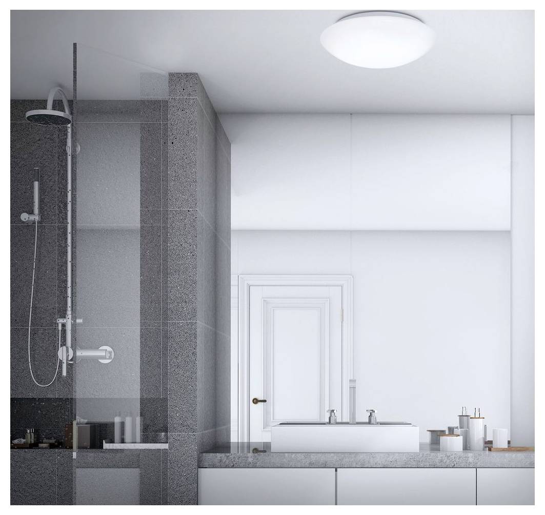Modernes Badezimmer mit einer glas-umschlossenen Dusche auf der linken Seite und einem weißen Waschtisch mit Waschbecken und Spiegel auf der rechten Seite.