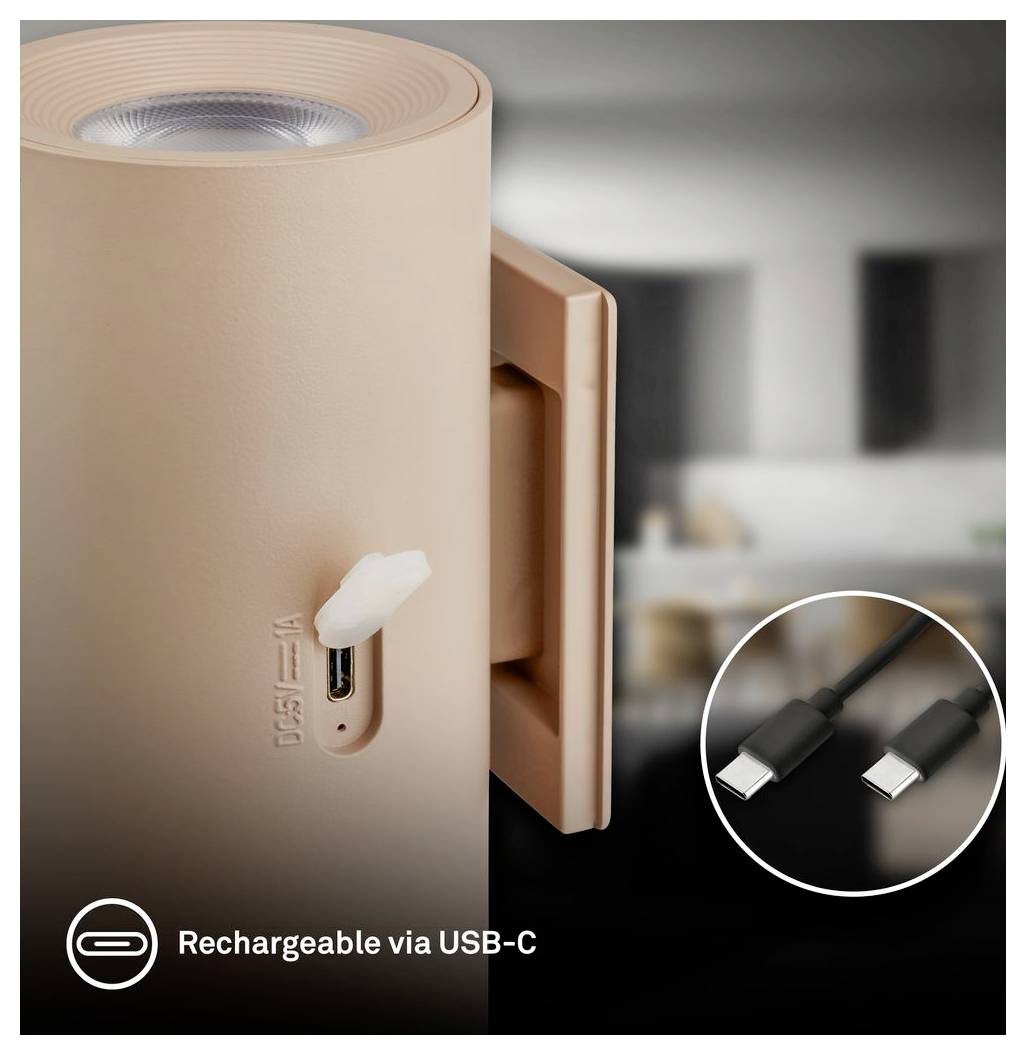 Tragbares beige Gerät mit USB-C-Ladeanschluss und Kabel, gekennzeichnet mit 
