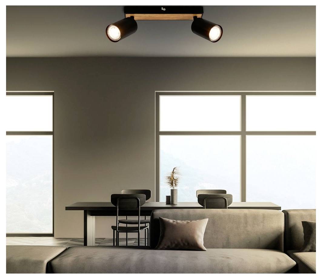 Modernes minimalistisches Wohnzimmer mit Sofa, Schreibtisch und Stuhl, großen Fenstern und Deckenspot oben.