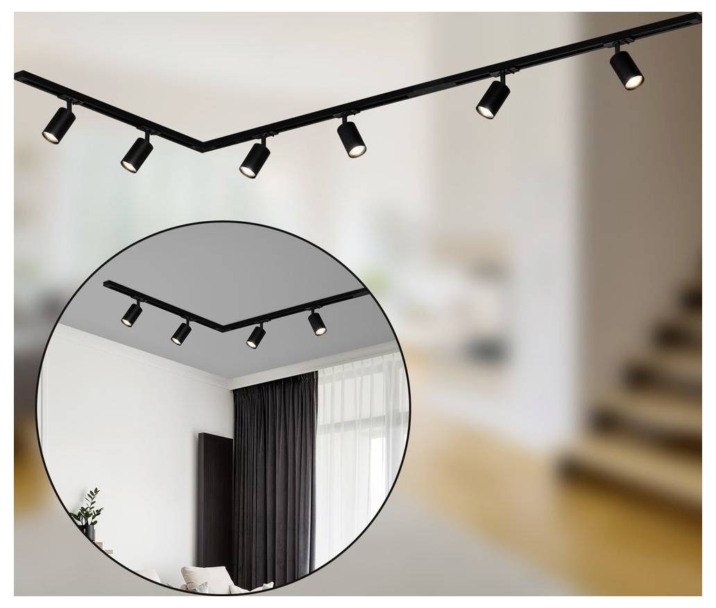Schwarze Schienensysteme mit verstellbaren Spotlights, die an einer Decke montiert sind, gezeigt in einem Raum mit einer kreisförmigen Einfassung, die die installierten Leuchten hervorhebt.