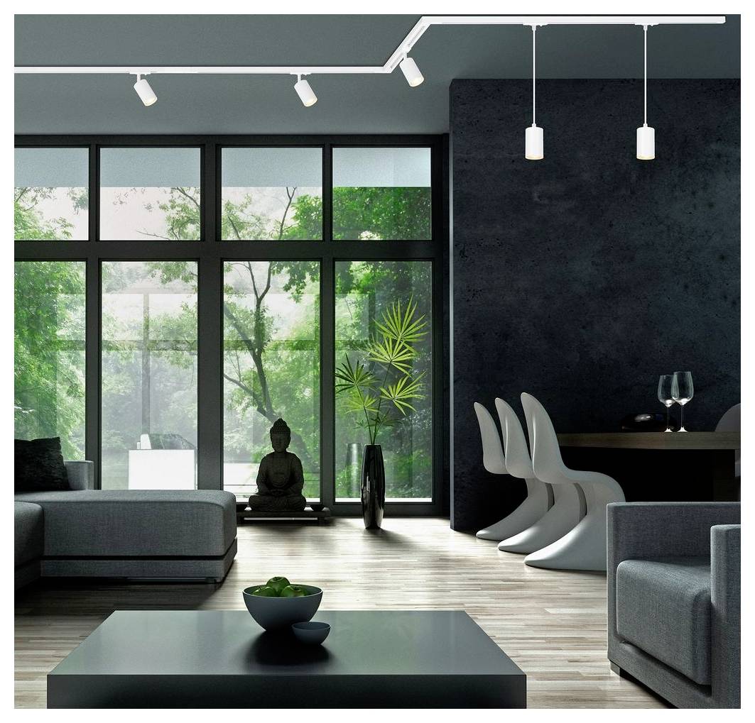 Modernes Wohnzimmer mit raumhohen Fenstern, dunklen Wänden, grauer Sitzgarnitur, einem Essbereich und einer kleinen Buddha-Statue neben dem Glas.