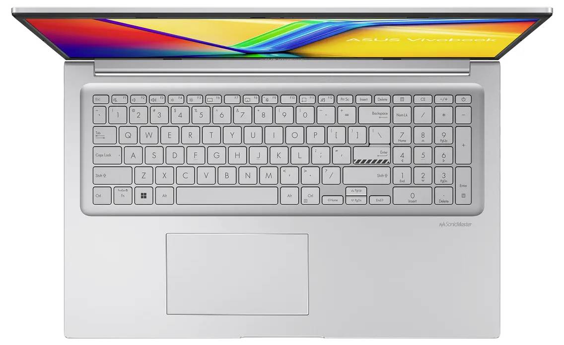 Draufsicht auf einen silbernen Laptop mit großer Tastatur und zentriertem Touchpad, geöffnet mit hellem mehrfarbigem Bildschirm.
