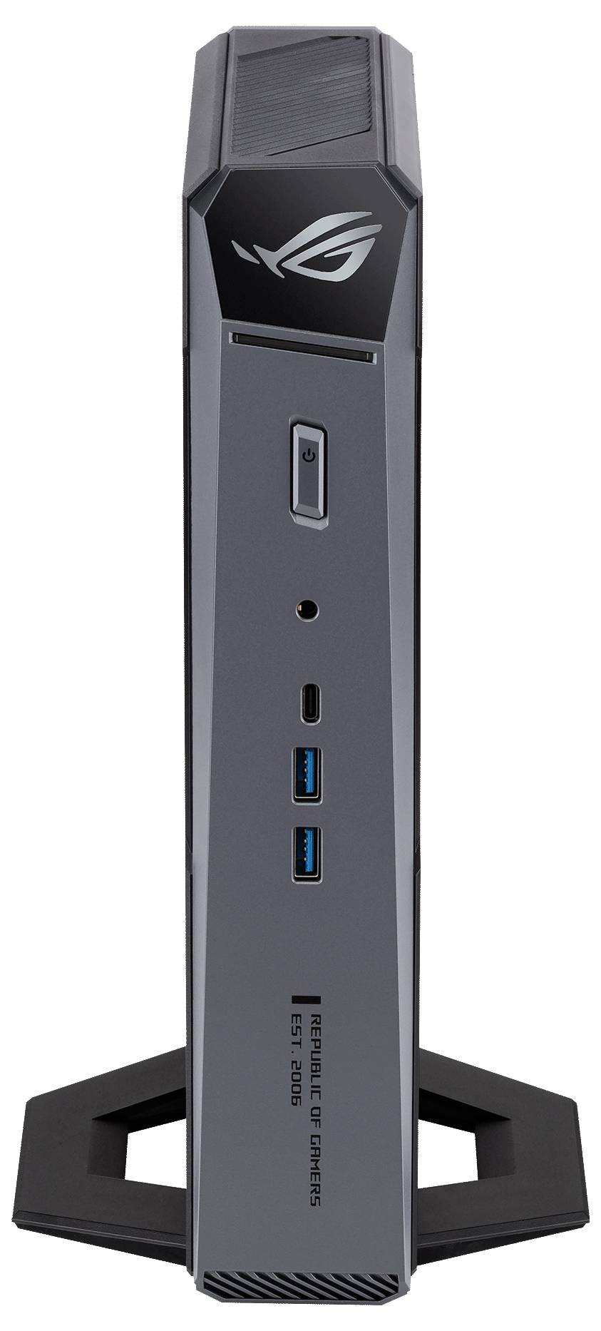 Vorderansicht eines schlanken schwarzen ASUS ROG Mini-PCs/Towers auf einem Ständer, mit beleuchtetem Logo und vorderen Anschlüssen einschließlich USB und Audiobuchse.