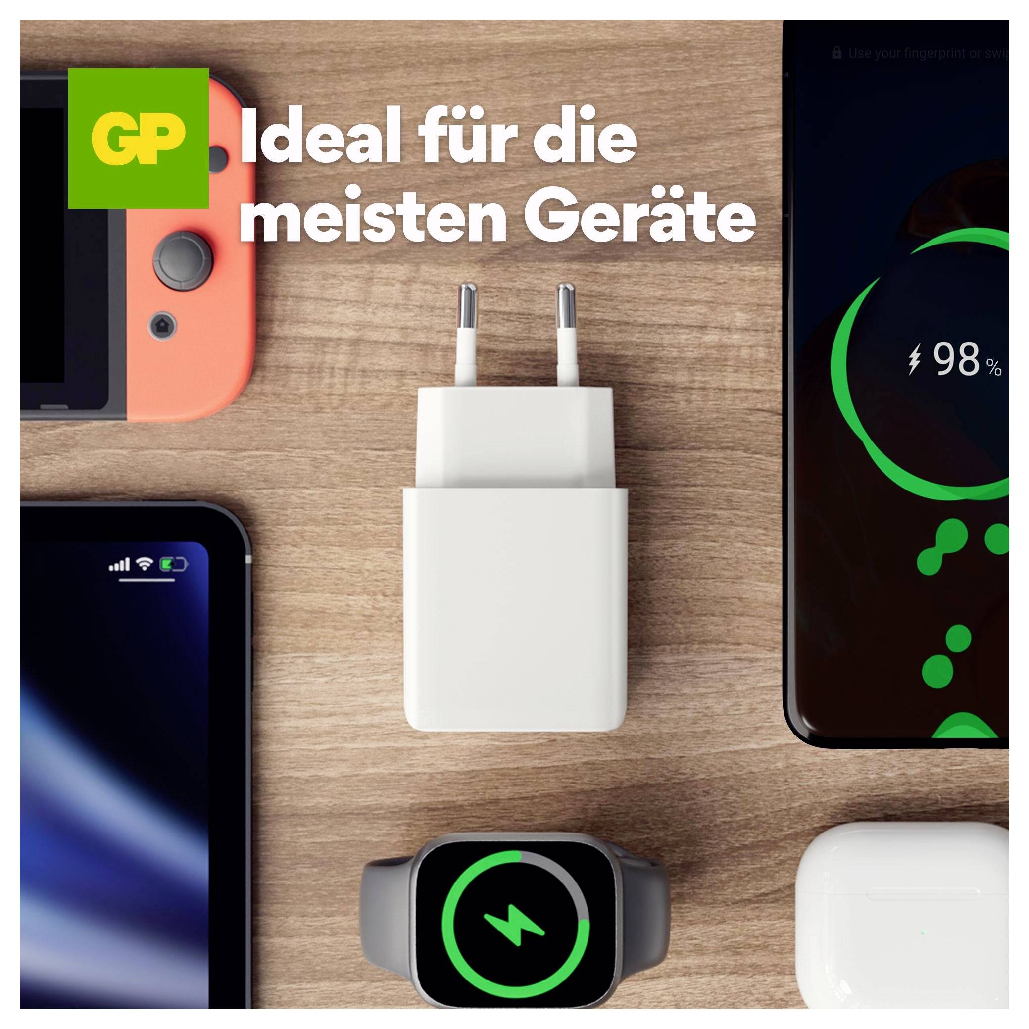 Anzeige zeigt einen weißen zweipoligen Stromadapter auf einer Holzoberfläche mit Telefonen und einer Smartwatch; Deutscher Text lautet „Ideal für die meisten Geräte