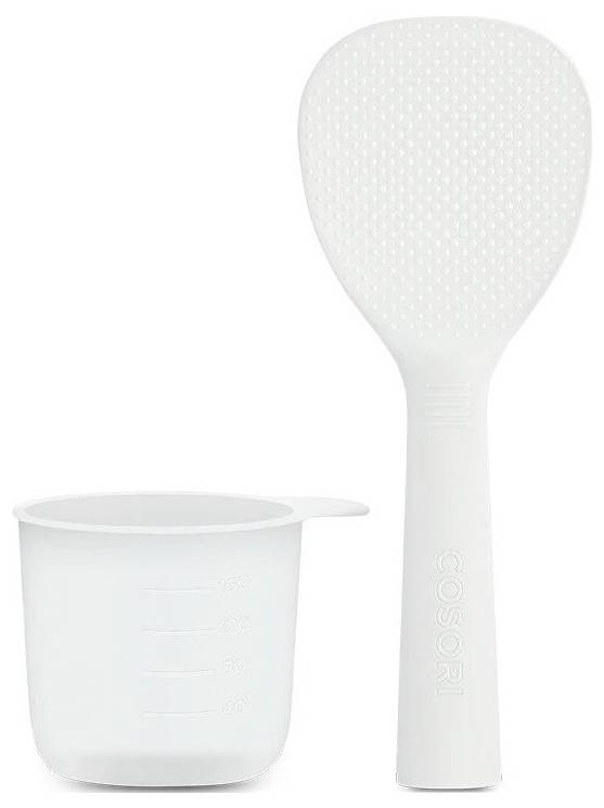Weiße Silikonkörperbürste und Mesbecher zum Mischen oder Auftragen von flüssigem Produkt.