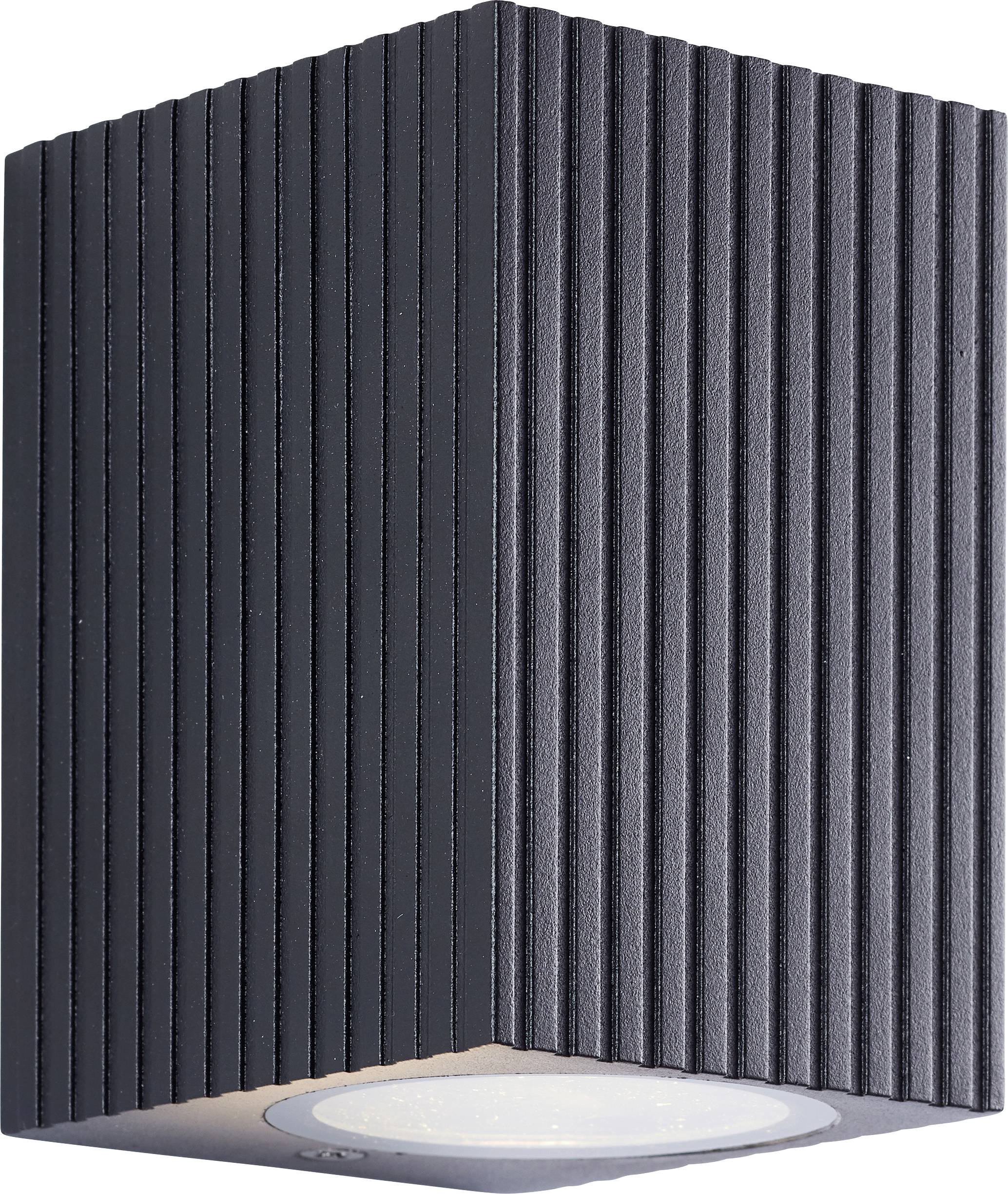 Schwarzte gerippte Deckenleuchte mit einer runden Einbau-Lampe auf der Unterseite.