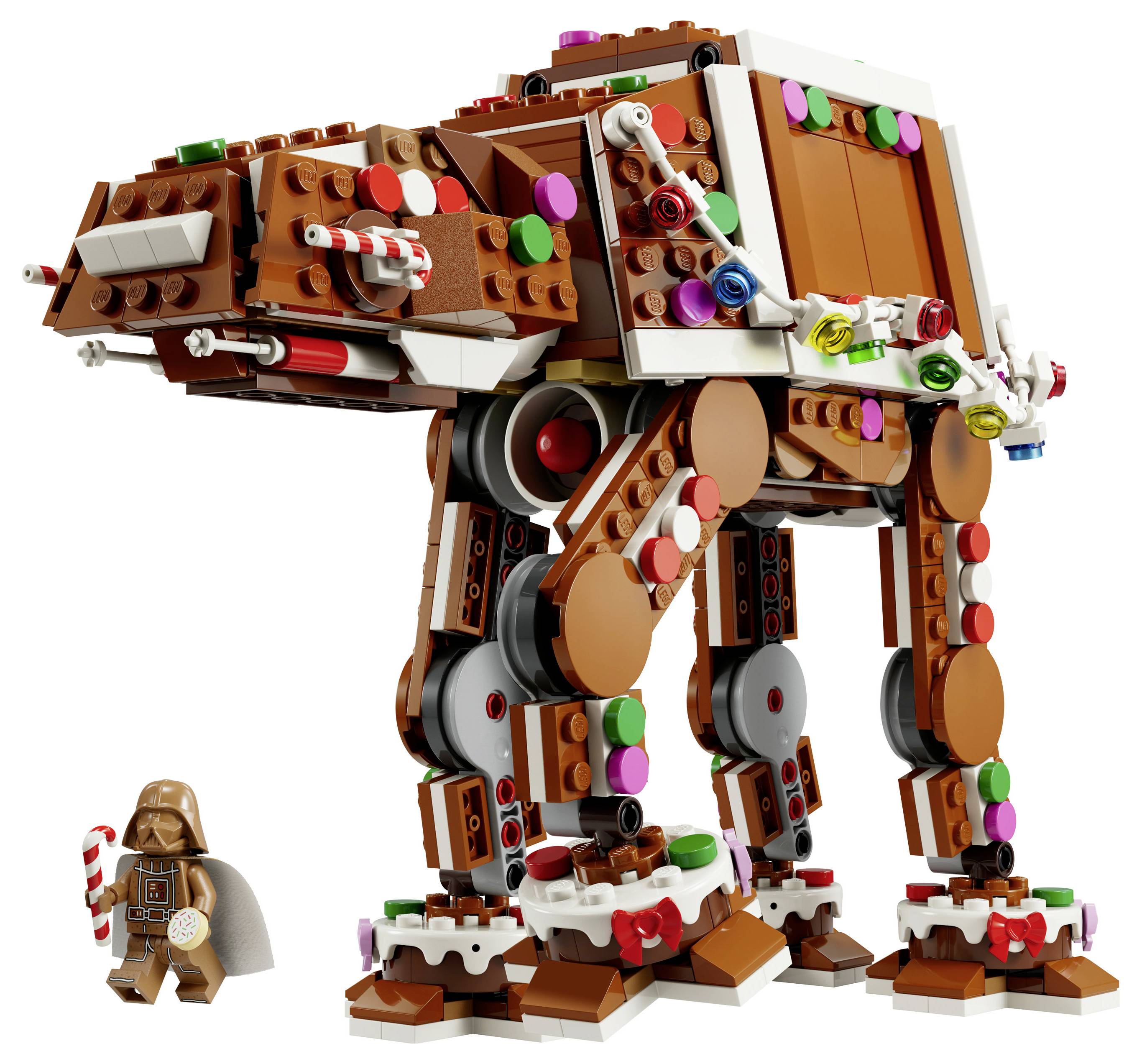 LEGO-ähnlicher riesiger schokoladenbrauner AT-AT-Laufwagen mit bunten Süßigkeitendetails und einer kleinen Darth-Vader-Minifigur, die daneben steht.