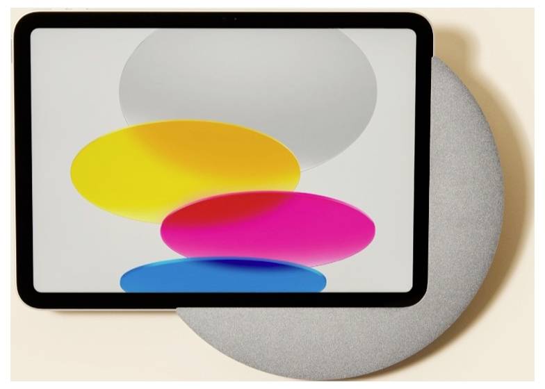 Ein Tablet oder Smart Display zeigt überlappende gelbe, rosa und blaue Ovalformen auf einem weißen Bildschirm, angebracht vor einem großen grauen kreisförmigen Hintergrund.