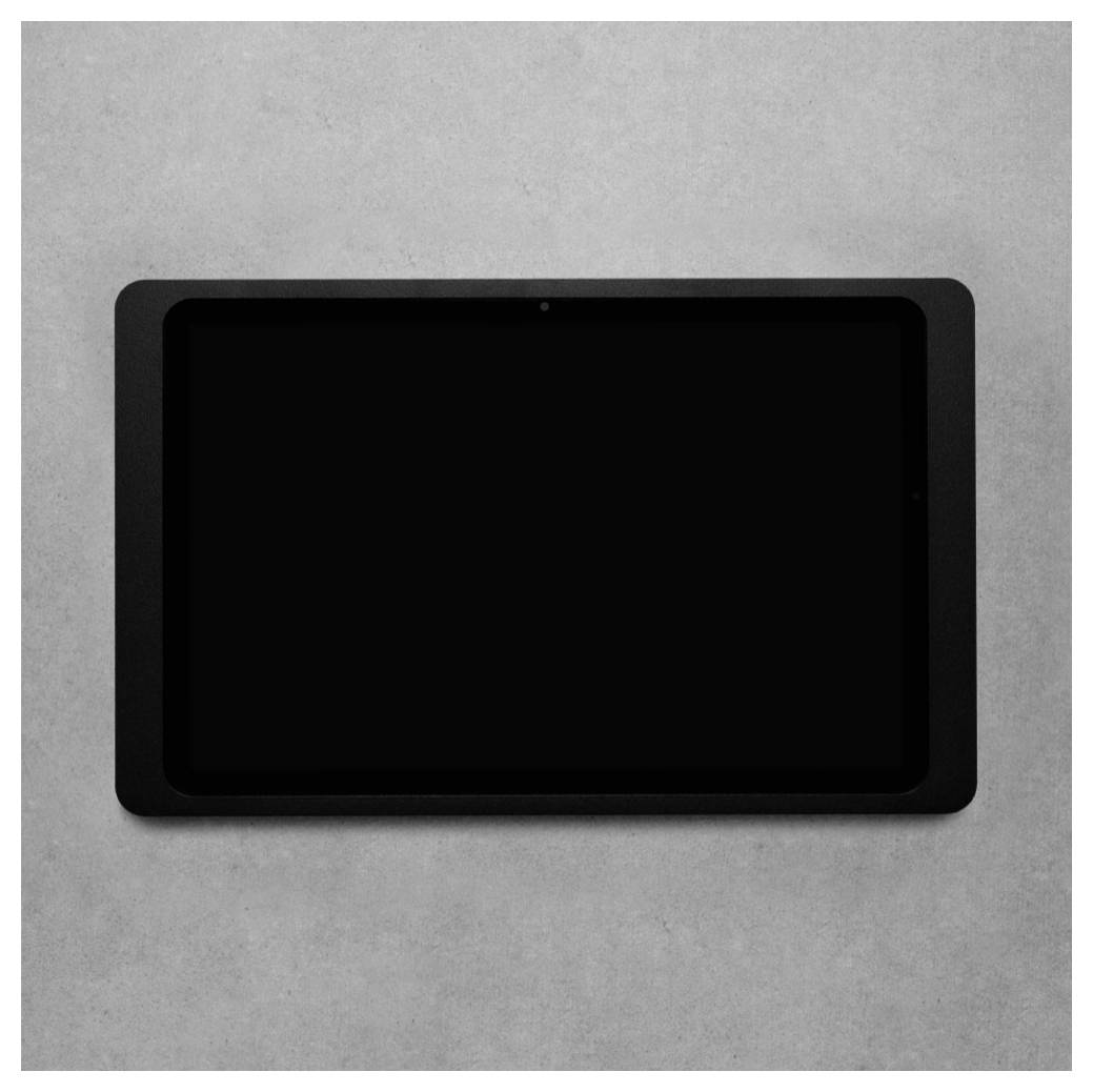 Schwarzer Tablet-Computer mit leerem Bildschirm auf einer hellgrauen Oberfläche.