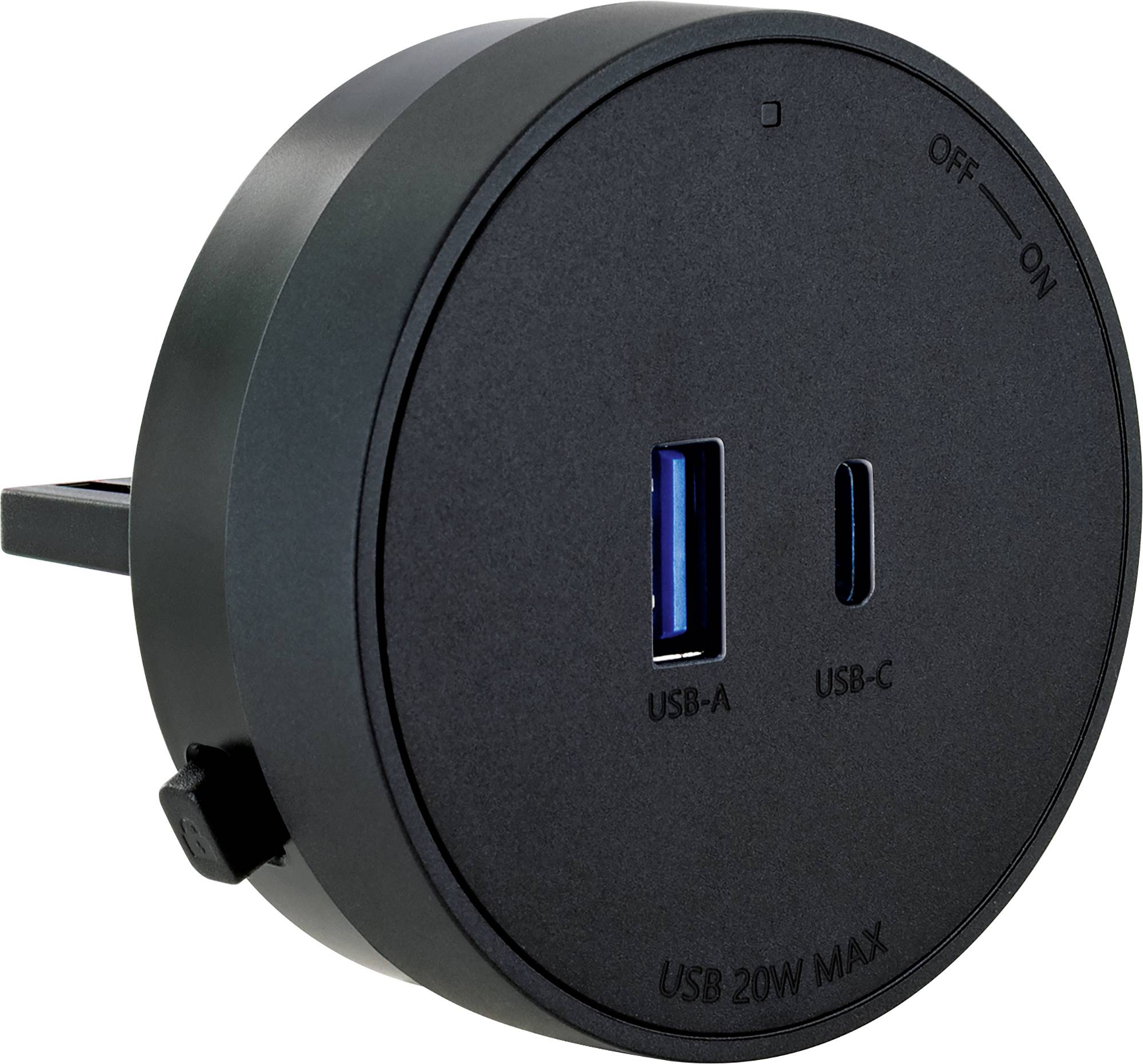 Runder schwarzer Wandladegerät mit klappbarem Stecker, Ein-/Ausschalter, USB-A und USB-C-Anschlüsse, beschriftet mit „USB 20W MAX