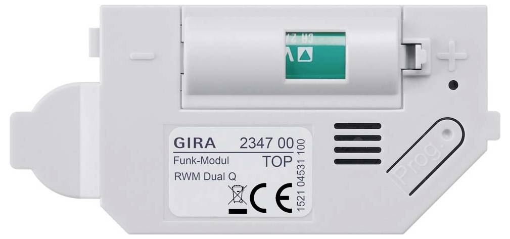 Weißes GIRA Funk-Modul RWM DuO Rauchwarnmelder-Funkmodul mit kleinem Display, Plus- und Minusreglern und CE-Kennzeichnung.