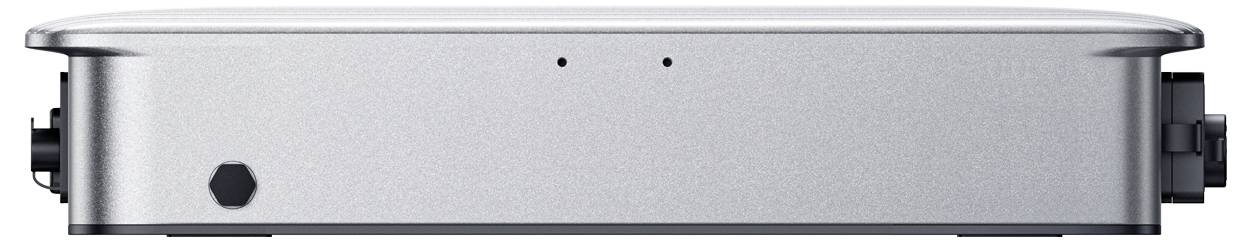 Seitenansicht eines silbernen elektronischen Geräts oder einer Gehäuseeinheit mit abgerundeter Oberseite, schwarzen Seitenbefestigungen und einem kleinen sechseckigen Anschluss an der Vorderseite.