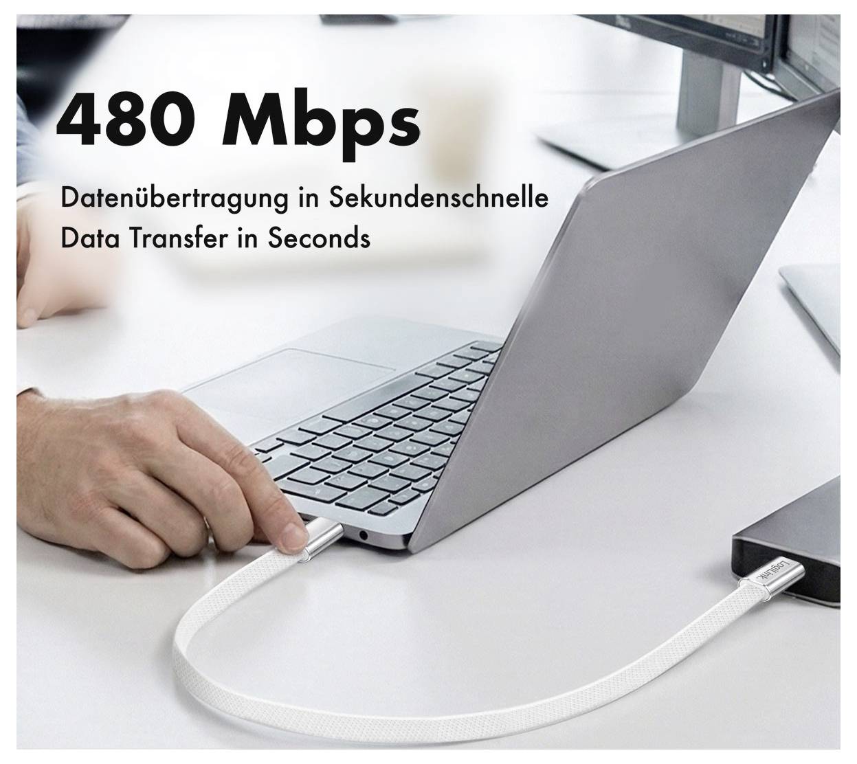Laptop über Kabel mit kleinem Gerät verbunden, mit Text „480 Mbps