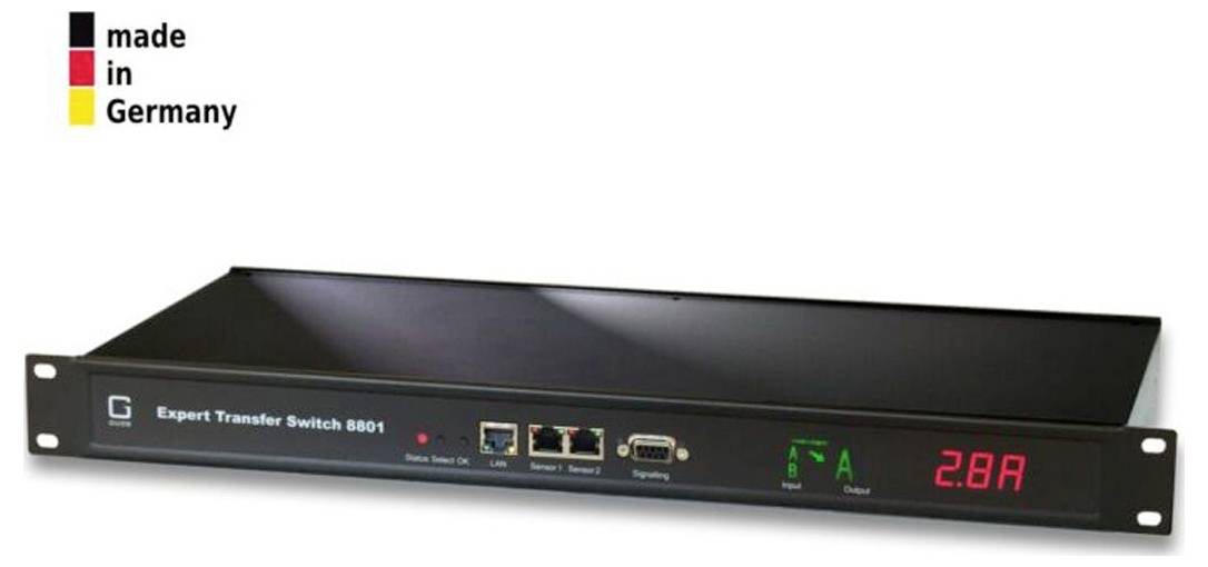 Vorderansicht eines einbaubaren 'Expert Transfer Switch 8801' mit digitaler Anzeige, die 2,8A anzeigt, und Statusanzeigen; 'Made in Germany'-Logo in der Ecke.