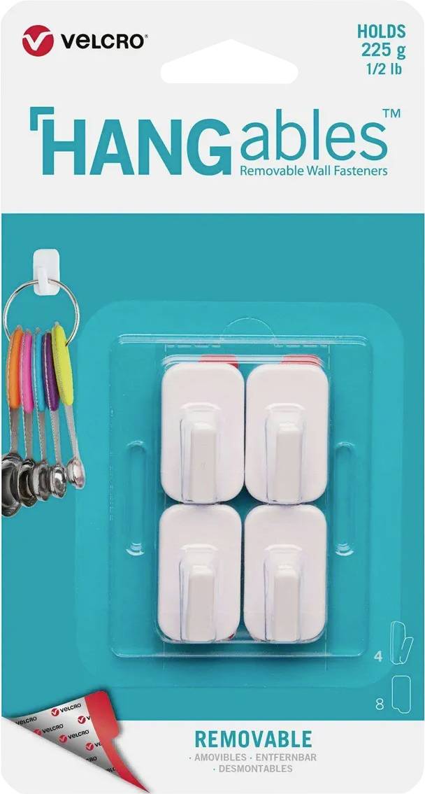 VELCRO HANGables ablösbare Wandbefestigungen Packung, hält 225 g und zeigt vier weiße Klebehaken auf tealfarbenem Hintergrund.