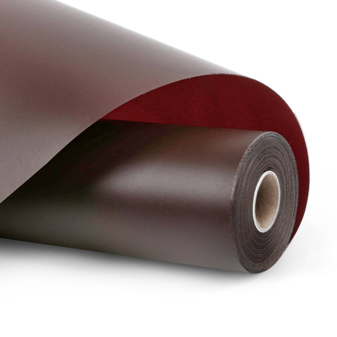 Aufgerolltes Blatt aus dunkelbraunem oder schwarzem Material mit roter Unterseite, dargestellt als aufgewickelte Spule auf weißem Hintergrund.