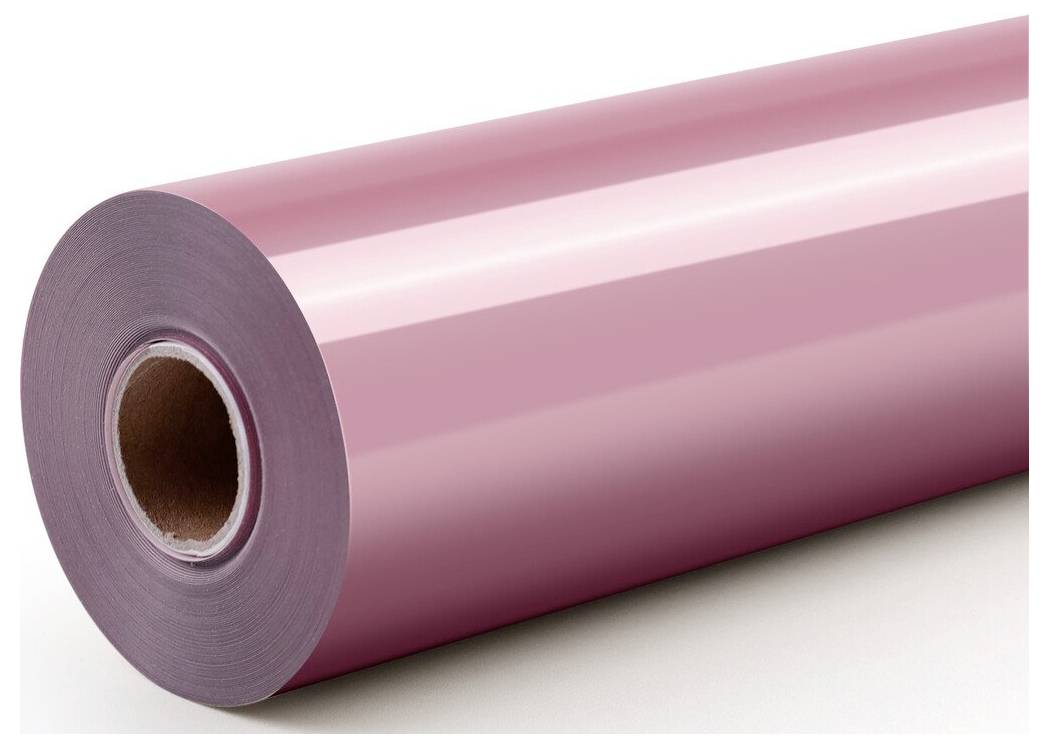 Eine große Rolle glänzendes rosa Film oder Papier auf weißem Hintergrund, in schräger Perspektive mit sichtbarem Kartonkern gezeigt.