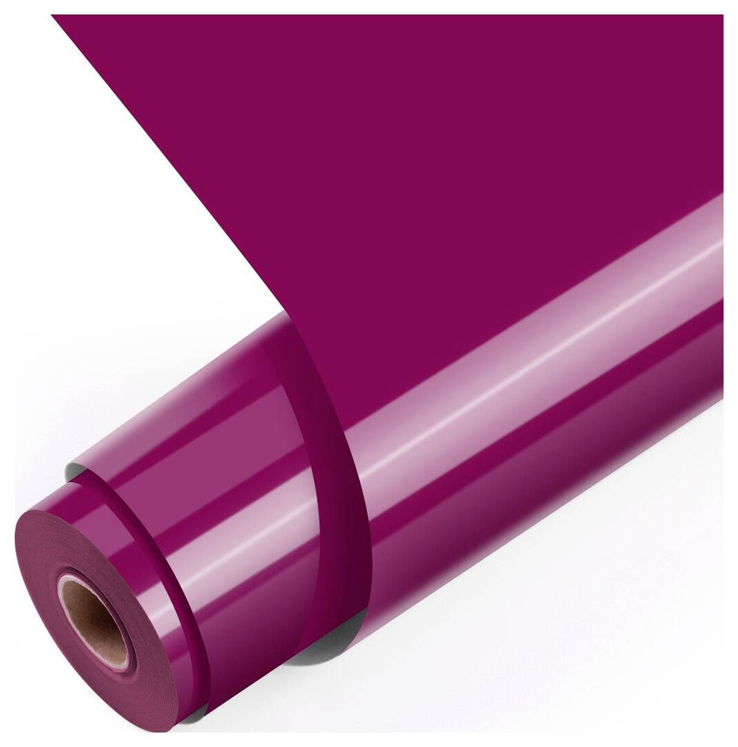 Rolle aus glänzendem Magenta-Film oder Verpackungsmaterial, teilweise abgewickelt auf weißem Hintergrund.
