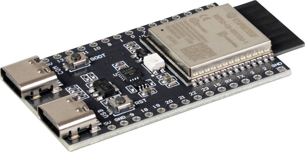 Schwarzes Mikrocontroller-Entwicklungsboard mit zwei USB-C-Anschlüssen und einem großen metallisch abgeschirmten Chip-Modul oben.