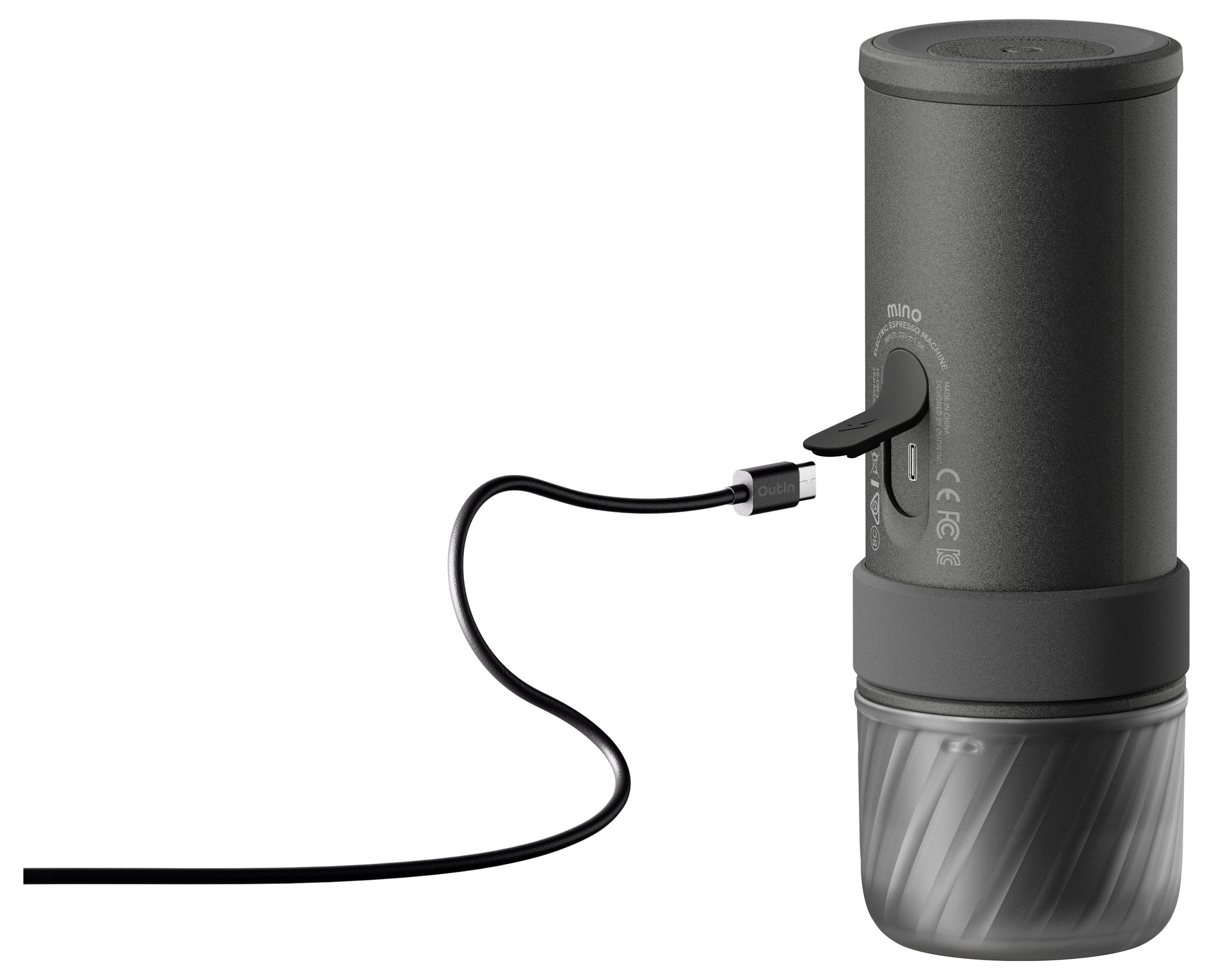 Tragbares schwarzes zylindrisches Gerät mit einem USB-Kabel, das in seine Seite eingesteckt ist und aufrecht auf weißem Hintergrund steht.