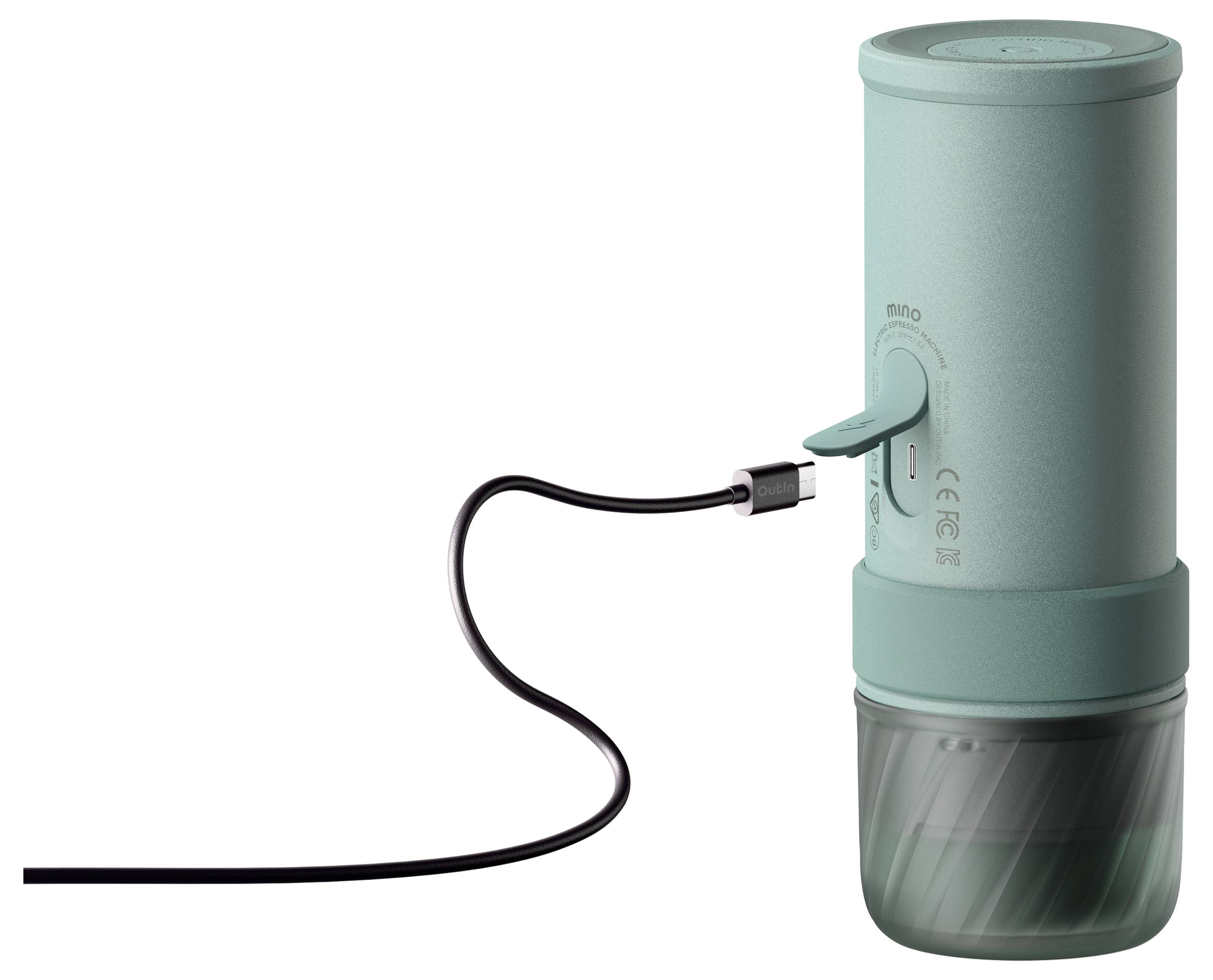 Tragbares Gerät in Teal-Farbe mit USB-Kabel, das in seine Seite gesteckt ist, vor weißem Hintergrund gezeigt.