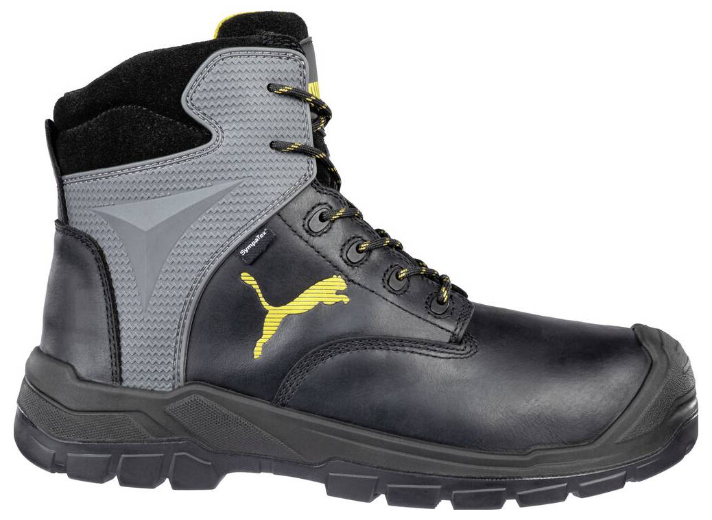 Schwarzer und grauer High-Top-Arbeitsschuh mit gelbem Puma-Logo, dicke profilierte Sohle, in Seitenansicht auf weißem Hintergrund dargestellt.