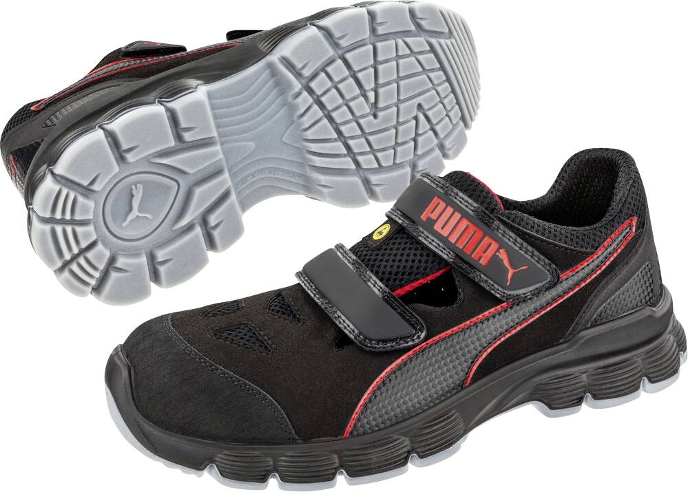 Schwarzer und roter Sicherheitsschuh von Puma mit Klettverschlussriemen, gezeigt mit der Sohle, wobei die strukturierte Profilsohle und das Schutzarbeitsschuh-Design hervorgehoben werden.