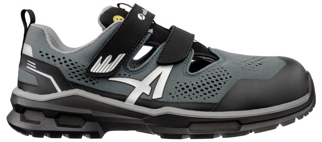 Grauer und schwarzer athletischer Arbeitschuh mit Riemenverschlüssen, seitlichem Logo und robuster schwarzer Sohle in Profilansicht auf weißem Hintergrund.