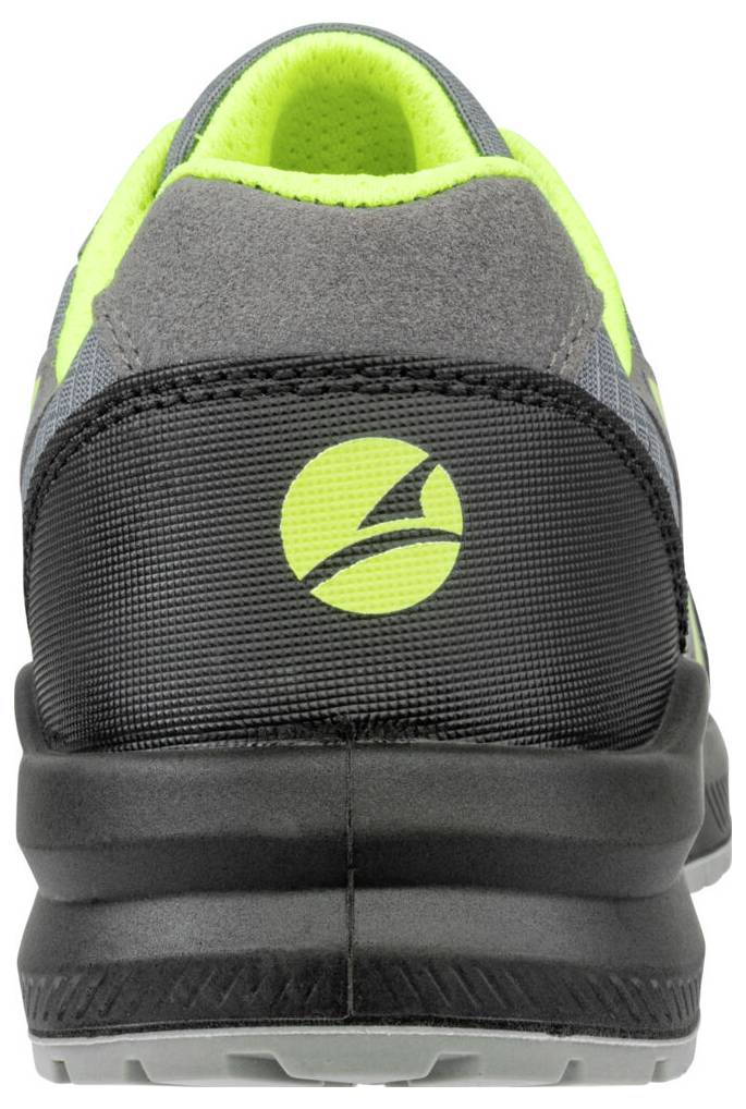 Rückansicht eines schwarzen, grauen und neongrünen Sportschuhs mit einem kreisförmigen Logo auf der Ferse.