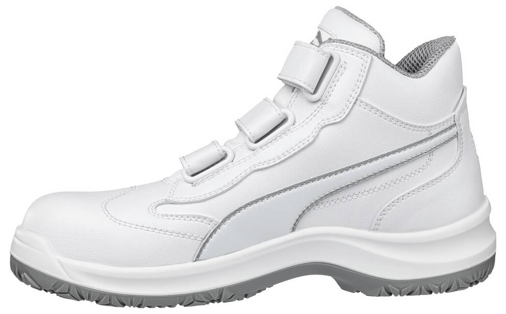 Weißer hoher Sneaker mit Klettverschluss-Riemen und dicker grauer Sohle, in Seitenansicht auf neutralem Hintergrund gezeigt.
